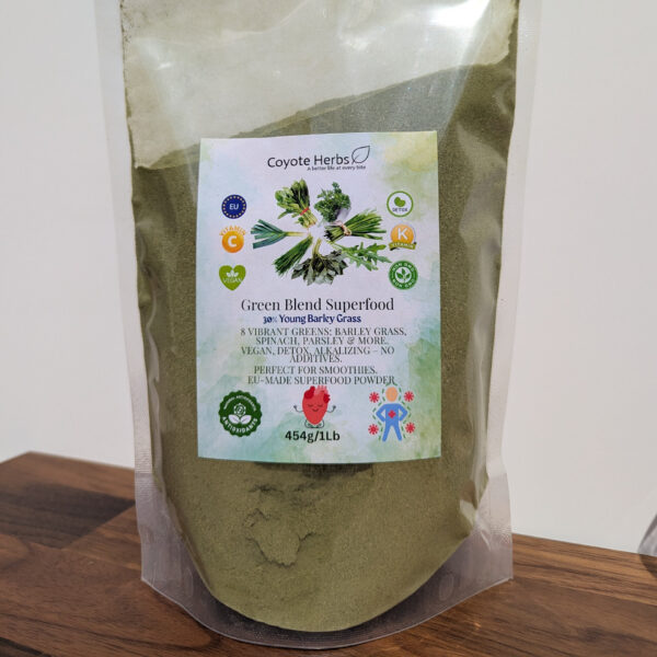 Vibrant green smoothie in a glass with fresh spinach and a banana, made with young barley powder.
